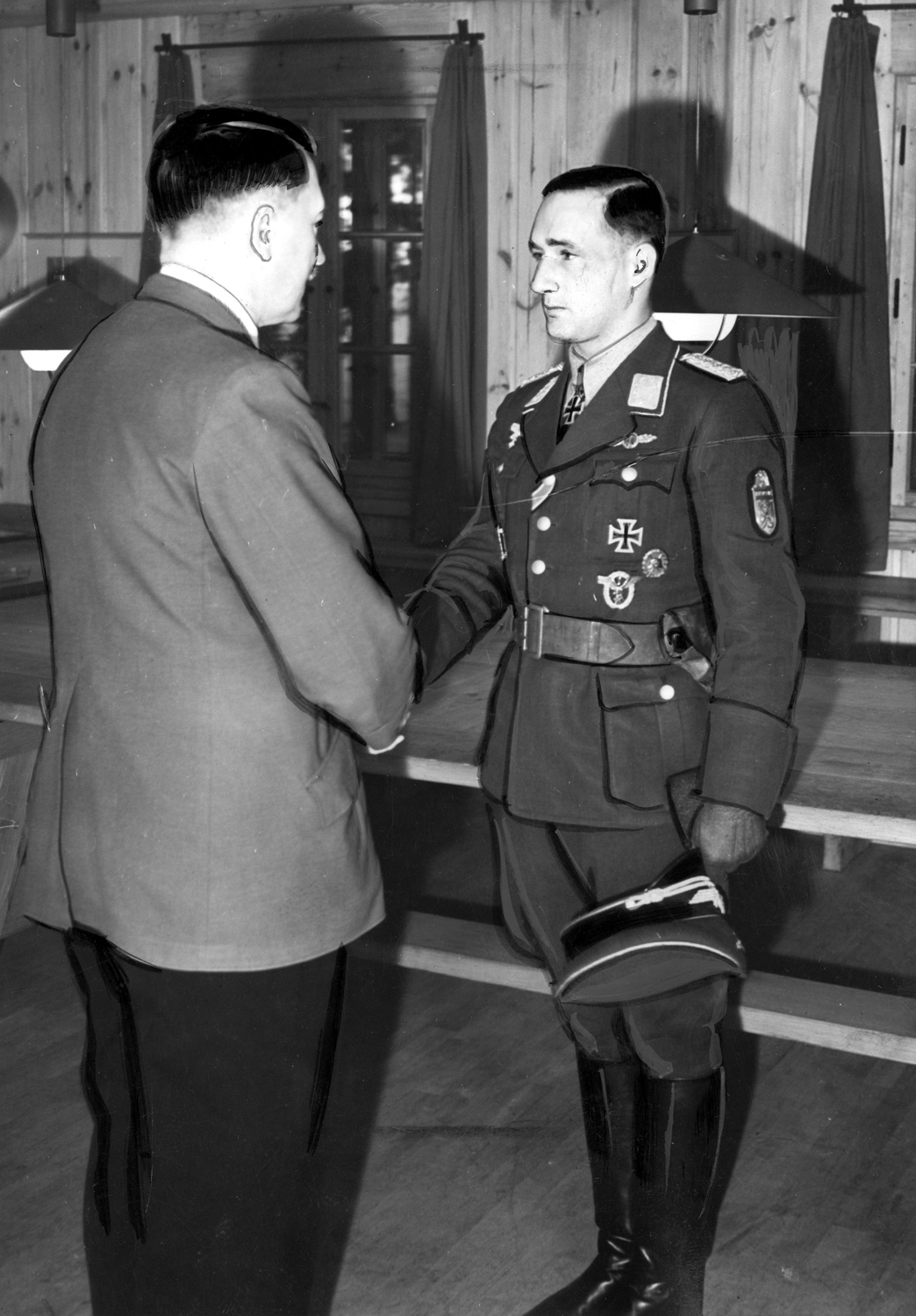 Adolf Hitler awards Gordon Gollob the Knight's Cross with Golden Oak Leaves, Swords, and Diamonds in Führerhauptquartier Werwolf  